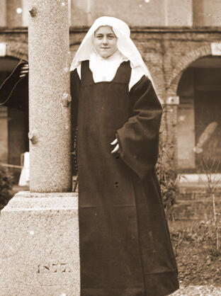St. Thérèse of Lisieux St. Thérèse of Lisieux stands for a portrait in the cloister garden.